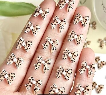 Nega noktiju: Set minijaturnih ukrasnih privesaka za nokte u obliku mašnica — 2