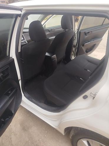 fielder: Toyota Corolla Fielder Hybrid – universal kuzovlu, ağ rəng. - Hibrid — 7