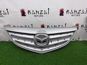 mazda 2000: Решетка радиатора Mazda 2004 г., Б/у, Оригинал — 1
