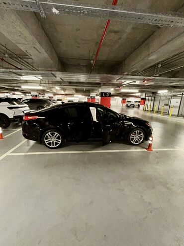 Kia: Kia Optima – qara rəng, sedan kuzov. Şəhərdaxili və magistral yollarda — 7