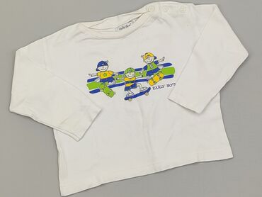 białe bluzki z żabotem: Bluzka, EarlyDays, 12-18 m, stan - Dobry