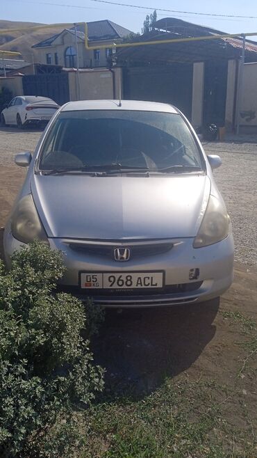 домкраты на авто: Honda Fit (серебристый хэтчбек) - Кузов: 5-дверный хэтчбек, цвет