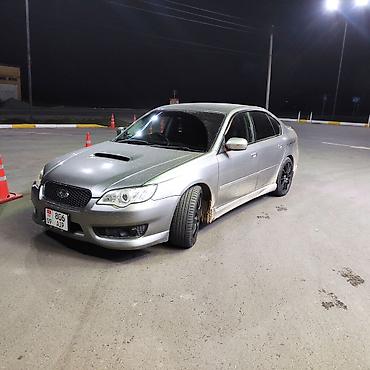 245 50 18: Легковой автомобиль Subaru Legacy (седан, серебристый цвет). Основные — 2