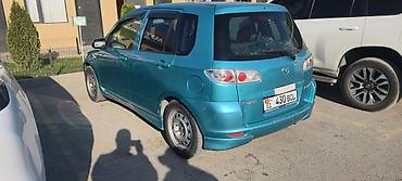 калганы: Mazda Demio: 2003 г., Автомат, Бензин — 9