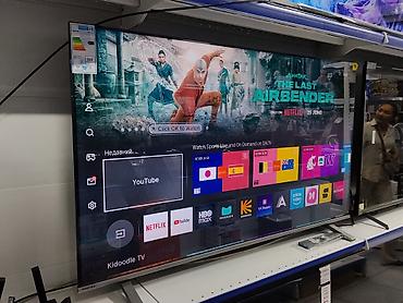 ТВ и видео: Смарт‑телевизор Toshiba, диагональ около 65–70". Тонкие рамки — 1