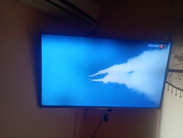 телевизор hisense 40 дюймов: Телевизор LG LED, диагональ около 40–43". Тонкие рамки серебристого
