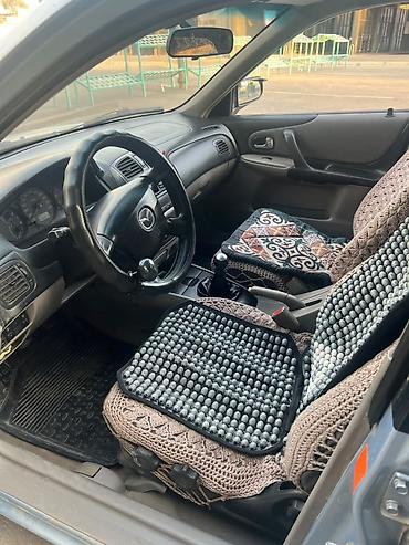 byd bot 384: Mazda 323: 2001 г., 1.6 л, Механика, Бензин, Универсал — 8