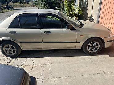 мотор нексия 1: Mazda 323: 1999 г., Седан — 1