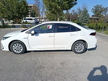 до 250000: Toyota Corolla: 2019 г., 1.8 л, Автомат, Гибрид, Седан — 2