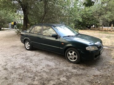 дождевик для мото: Mazda 323: 1999 г., 1.6 л, Механика, Бензин, Седан
