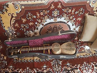 azerbaycan gitara mahnilari: Tar istifadə olunur – klassik Azərbaycan tarı, sərt futlyarla — 1