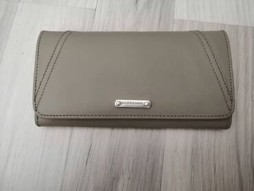 Personal Items: Burberry leather wallet in very good condition, many compartments as