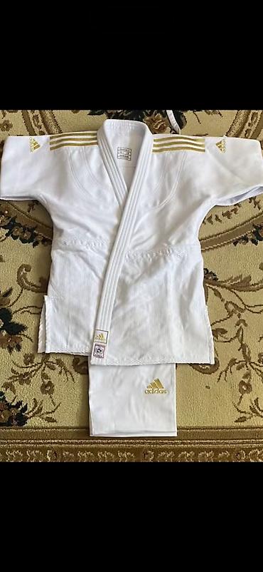 Adidas cüdo kimono dəsti - Rəng: ağ, qızılı detallar ilə Arginaldı lalafo.az -da Adidas cüdo kimono dəsti - Rəng: ağ, qızılı detallar ilə Arginaldı
