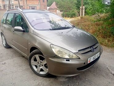 семёрка ош: Универсал Peugeot 307 в цвете хаки. Автомобиль оснащен рейлингами на