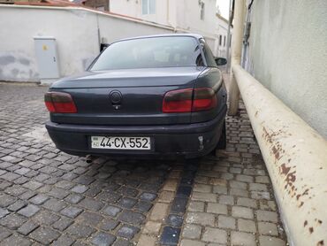 Sirena Motors: Opel Omega sedan Xüsusiyyətlər: - Kuzov: 4 qapılı sedan, tünd boz