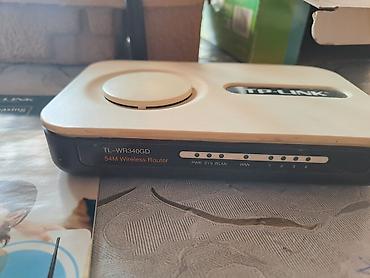 printer 3 u birində: TP-Link brendinə məxsus 54Mbps sürətə malik, simsiz G router. Bu cihaz — 3