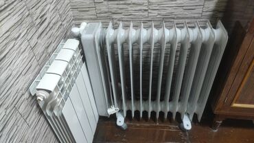 Paltaryuyan maşınlar: Ağ rəngli, təkərli, daşınması asan yağlı radiator. Bu radiator rahat