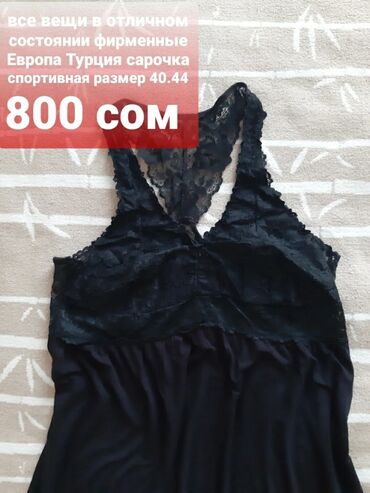 Другая женская одежда: Джинсовый комбинезон синего цвета с классическим дизайном. Модель — 25