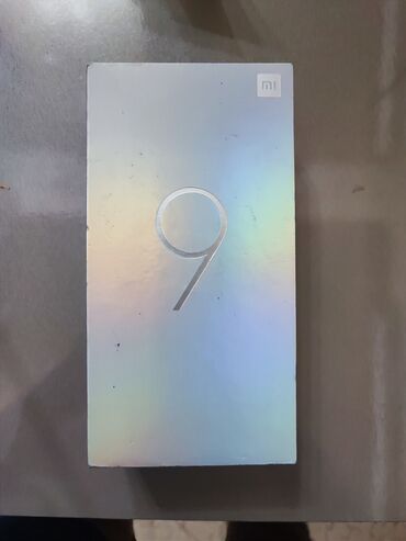 xiaomi mi a1 qiymeti irshad: Xiaomi Mi 9, 128 ГБ, цвет - Голубой, 
 Сенсорный, Отпечаток пальца, Беспроводная зарядка