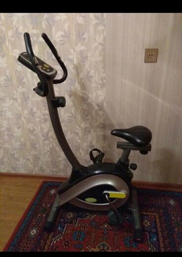 Digər idman və istirahət malları: Stasionar velosiped (exercise bike) - Şaquli tip: pedallı kardio