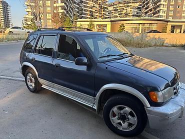 mustan: Kia Sportage: 2 l | 1999 il Ofrouder/SUV — 4