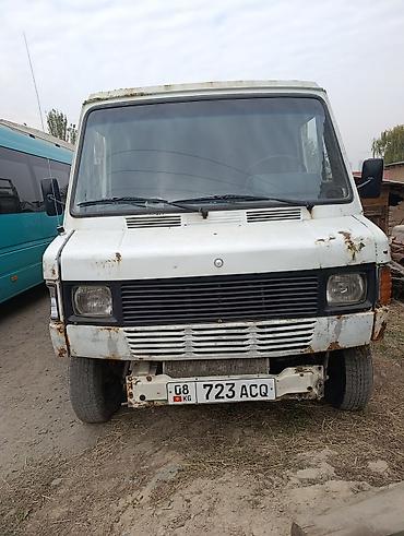 34 е: Грузовой бортовой микро-грузовик с высокой металлической платформой — 1