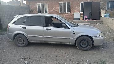 Унаа сатуу: Mazda 323: 2002 г., 1.3 л, Кол менен иштөөчү, Бензин, Универсал — 3