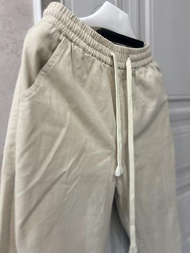 Брюки: Bej rəngli rahat şalvar (unisex stil) - Model: İpi ilə tənzimlənən — 1