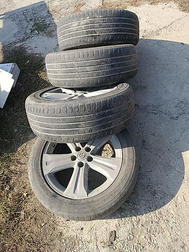 колпачки: Комплект колёс Toyota в сборе: оригинальные литые диски с шинами — 4
