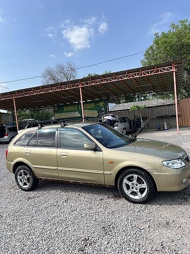 Mazda: Mazda 323: 2003 г., Бензин — 3