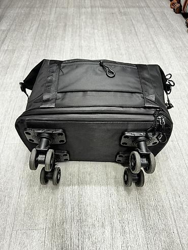 дорожная сумка купить: Дорожная сумка на колесах, черная - Форм-фактор: объемная сумка-баул — 3