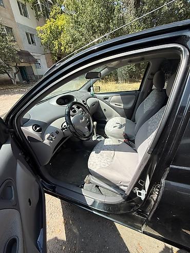 электро машине: Toyota Echo: 2002 г., 1.5 л, Автомат, Газ, Седан — 5