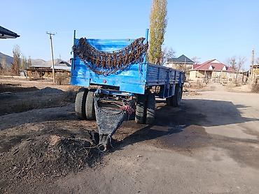 Одноосный/двухосный прицеп-самосвал бортовой синего цвета. Основные