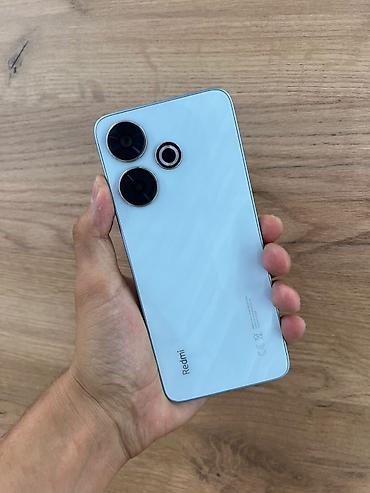swift 3: Смартфон Redmi 13 (модель 2404ARN45A), цвет светло‑голубой. Ключевые — 1