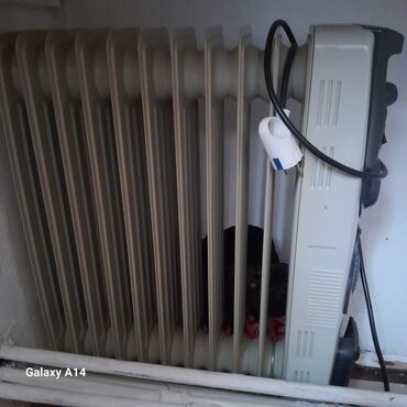 Elektrikli qızdırıcılar və radiatorlar: Isdliy sistemi ateplena toklla 50 az xaqlar heç bir prablemi yoxdu