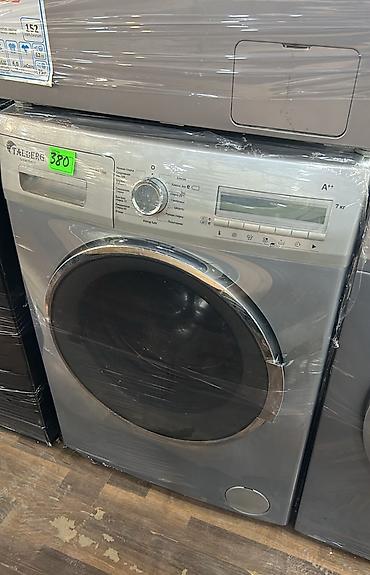 Öndən yükləməli paltaryuyan maşın, 7 kq tutuma malikdir. Korpus gümüşü