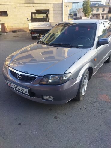 кооператив авто: Mazda 323: 2002 г., 1.6 л, Механика, Бензин, Седан