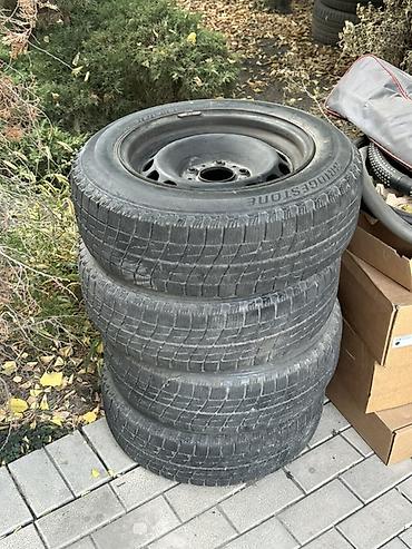 Комплект из 4 зимних шин Bridgestone на стальных дисках at lalafo.kg Комплект из 4 зимних шин Bridgestone на стальных дисках