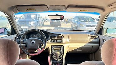 футляр для кия: Mazda Capella: 2001 г., 2 л, Автомат, Бензин, Седан — 10