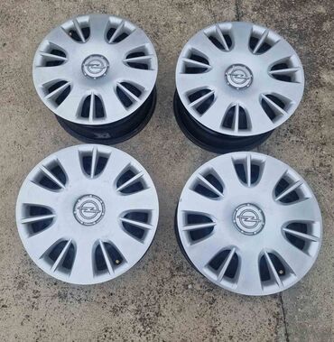 Gume i felne: Komplet od 4 čelične felne sa originalnim Opel ratkapama. - na lalafo.rs — 2 Gume i felne: Komplet od 4 čelične felne sa originalnim Opel ratkapama. - — 2