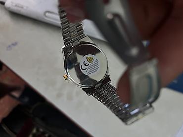 saat aksesuar: Qol saatı – iki rəngli (gümüşü və qızılı) metal qolbağlı, daşlı model — 1