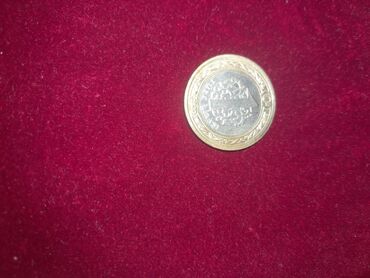 gümüş qaşıq alıram: İki metallı kolleksiya sikkəsi - Mərkəzi hissə gümüşü rəngdə, kənar
