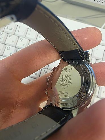 Наручные часы: Tissot markalı qol saatı qara rəngli siferblat və dəri kəmərlə klassik — 1