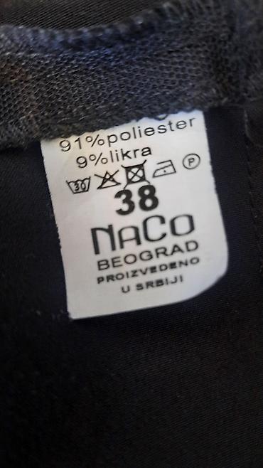 Kombinezoni: Elegantni crni ženski kombinezon bez rukava NACO,br.38 - Kroj: ravne — 3
