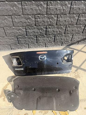 Крышка багажника Mazda 3 седан Оригинальная деталь с заводскими