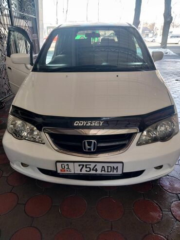 на одисей: Honda Odyssey – минивэн белого цвета. Этот автомобиль подходит для