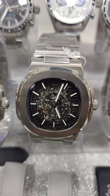 bakida saat: Patek Philippe Nautilus üslubunda kişi saatları – polad korpus və — 7