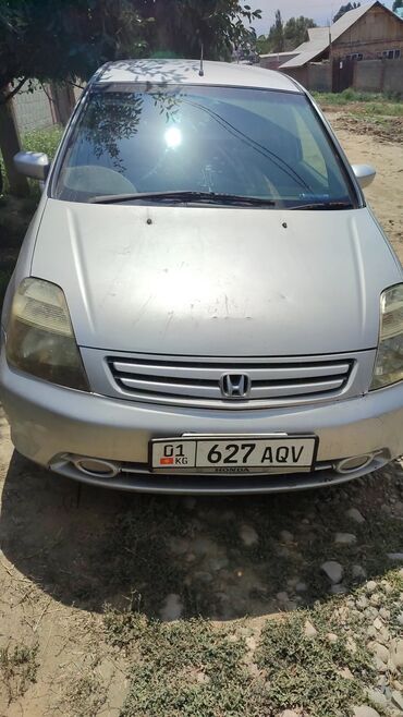 диск gx: Минивэн Honda Stream серебристого цвета с передним расположением