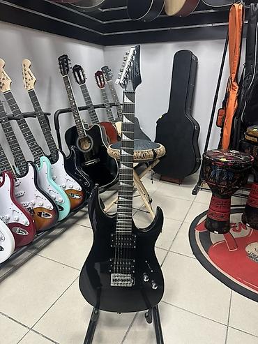 Электрогитара новая, типа Ibanez RG. Выглядит эффектно. Звук мощный