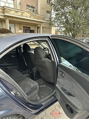 төө куш: Nissan Primera: 2002 г., Хетчбек — 10